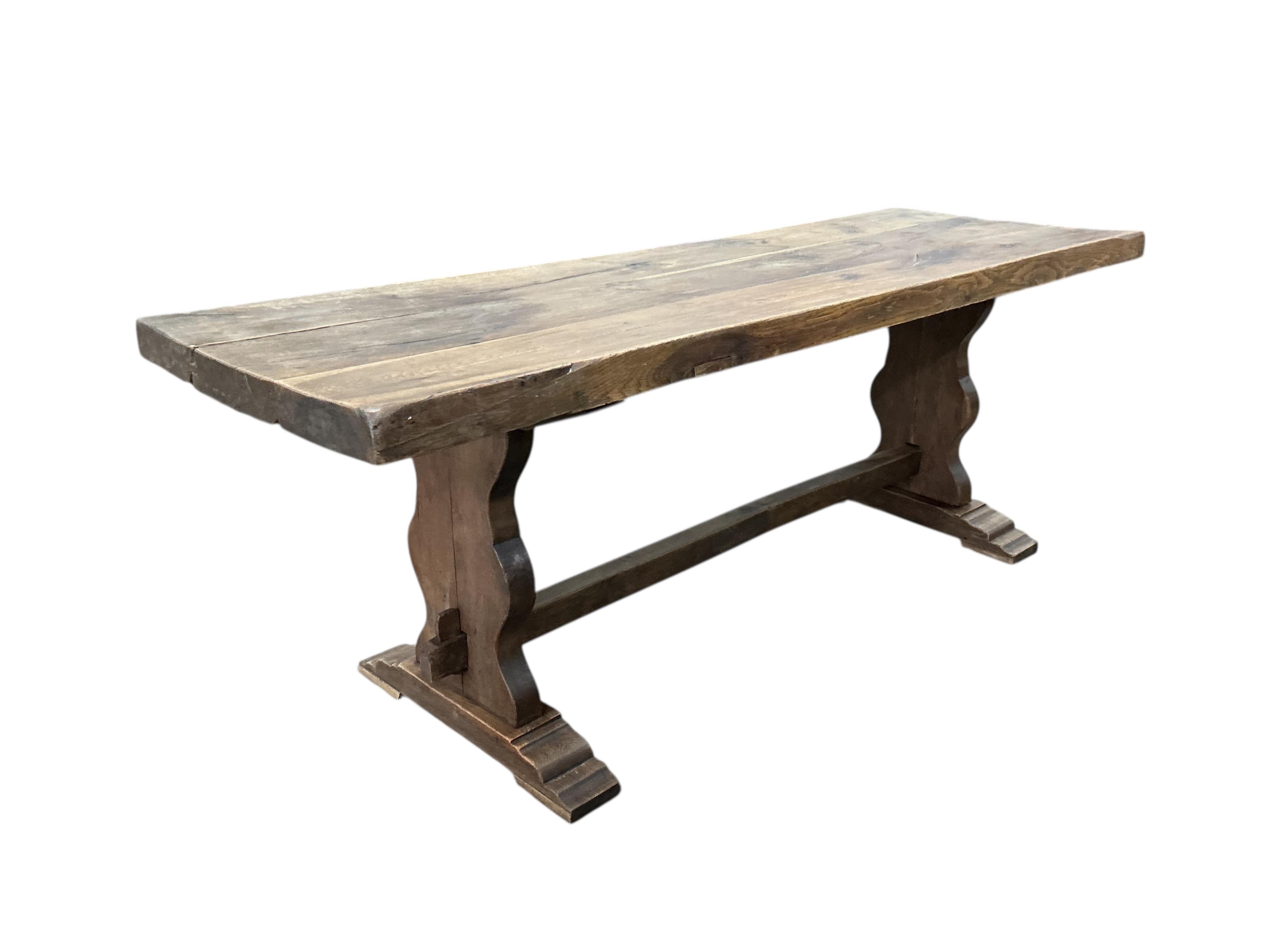 An 18th century style rectangular oak refectory dining table, width 214cm, depth 72cm, height 78cm